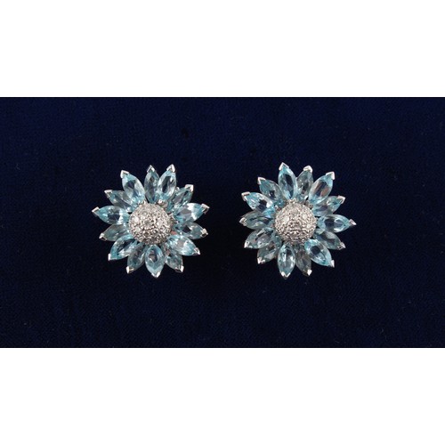 75 - A good pair of 18ct white gold pale blue topaz & diamond flowerhead earrings, possibly Asprey, with ... 