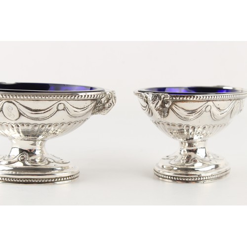 200 - Property of a deceased estate - a set of four George III silver navette shaped pedestal salts with r... 