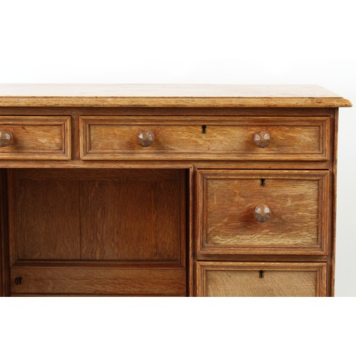 378 - Property of a deceased estate - a small Cotswold School oak kneehole desk attributed to Peter Waals ... 