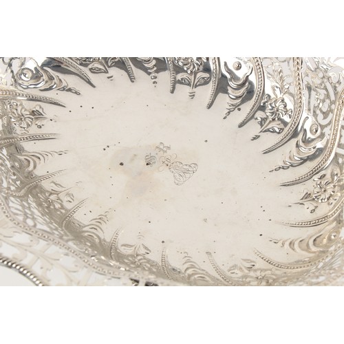 213 - Property of a deceased estate - a George III silver pierced oval bread basket with swing handle, eng... 