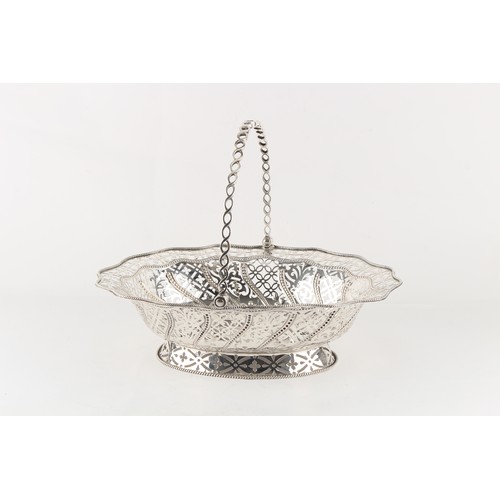 213 - Property of a deceased estate - a George III silver pierced oval bread basket with swing handle, eng... 