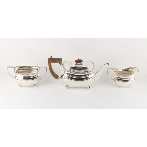 224 - Property of a gentleman - an early 20th century Art Deco silver three piece tea set, Edward & Sons, ... 