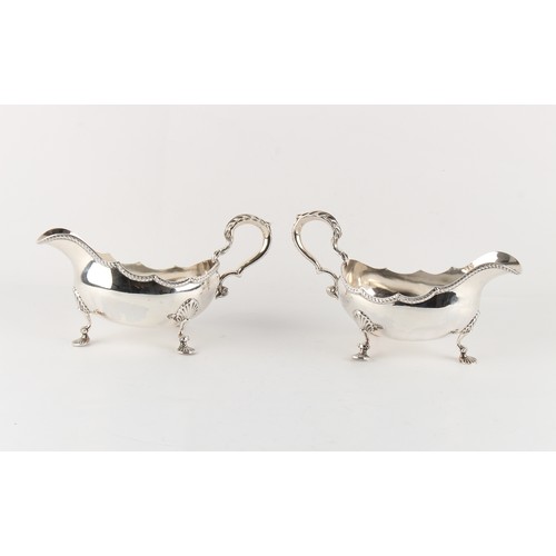 241 - Property of a deceased estate - a pair of good grade modern silver sauceboats, in the George I style... 