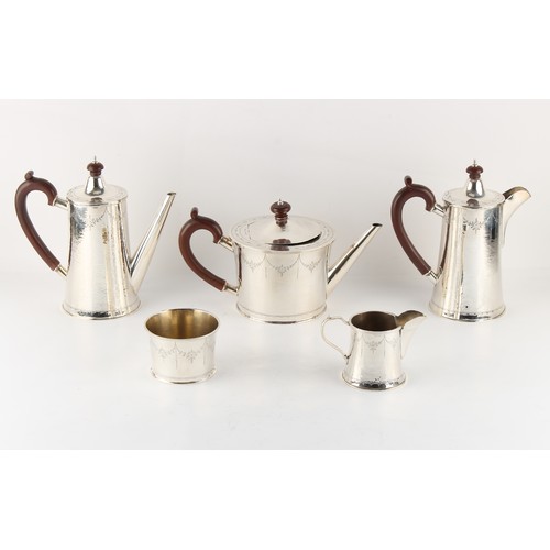 243 - Property of a deceased estate - a modern silver five piece tea & coffee set, with hammered decoratio... 