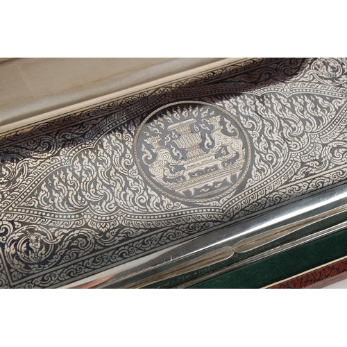 253 - Property of a lady - a Thai sterling silver & niello decorated cigarette box, with engraved presenta... 