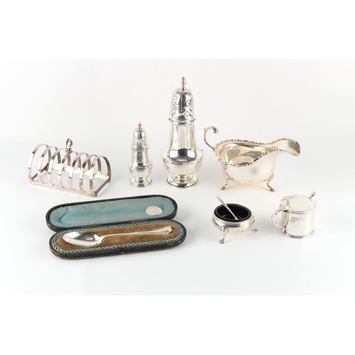 265 - Property of a gentleman - a mixed lot of silver including a sauceboat, two casters, a toast rack, an... 