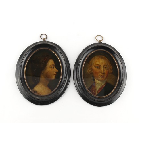 28 - Property of a gentleman - a pair of George III ebonised oval framed mezzotints on glass depicting po... 