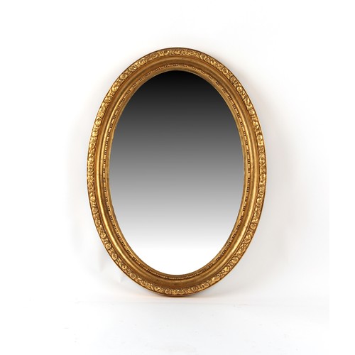 308 - Property of a deceased estate - an early 20th century gilt painted oval framed wall mirror, 36 by 26... 