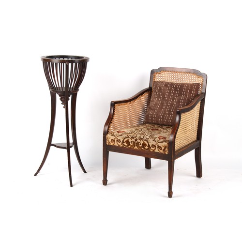 303 - Property of a deceased estate - an early 20th century cane panelled bergere armchair; together with ... 