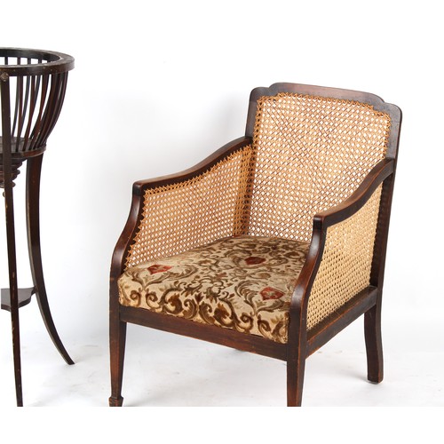 303 - Property of a deceased estate - an early 20th century cane panelled bergere armchair; together with ... 