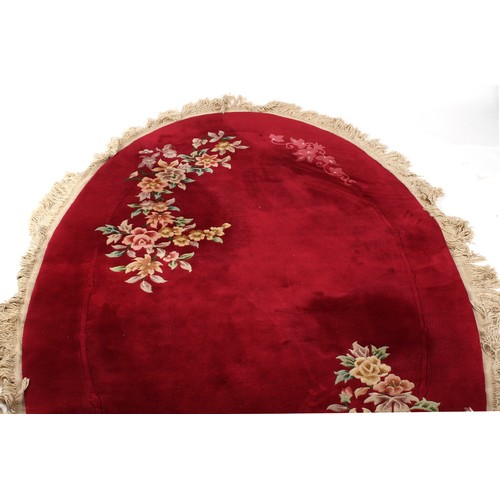 291 - Property of a deceased estate - a modern Chinese hand-knotted wool oval rug with burgundy ground, ap... 