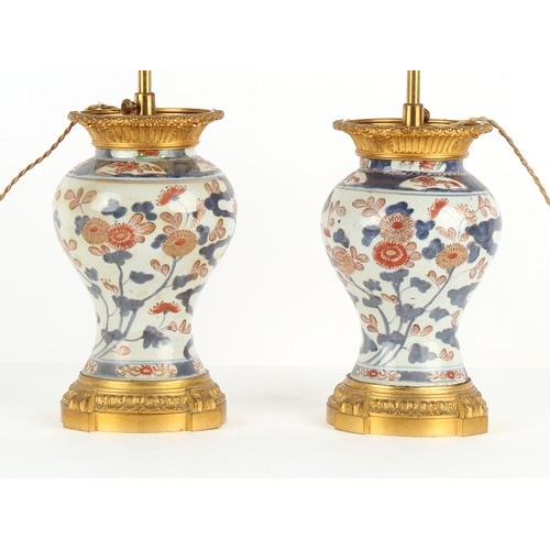 231 - Property of a lady - a pair of Japanese Imari baluster vases, Edo period, 18th century, mounted as t... 