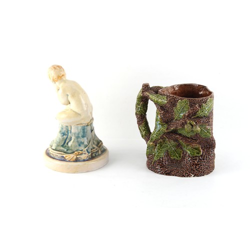 186 - A Sussex Ware (Rye ?) pottery jug modelled as an oak tree trunk with acorns & leaves, 5.5ins. (14cms... 