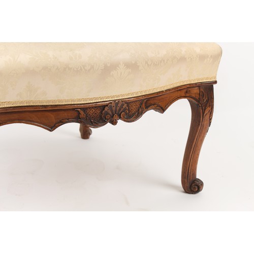 328 - Property of a lady - an 18th century French Louis XV carved fruitwood fauteuil, with cabriole legs.