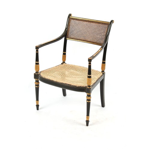 332 - Property of a lady - a 19th century ebonised & parcel gilt elbow chair with cane panelled back & sea... 