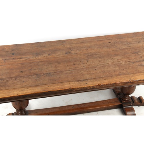 325 - Property of a lady - a good Cromwellian style oak refectory table, with cup & cover supports united ... 