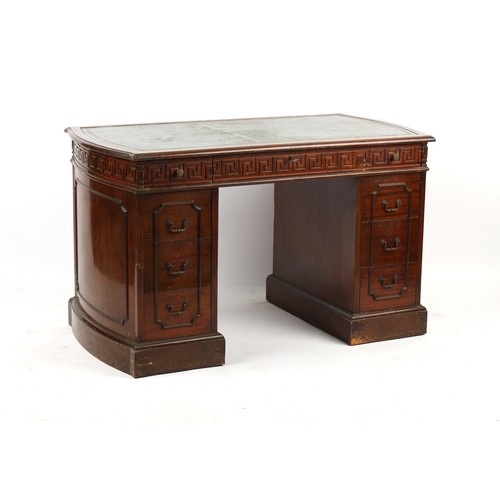 315 - Property of a lady - a mahogany twin pedestal desk, probably American, with key fret band & bowed en... 