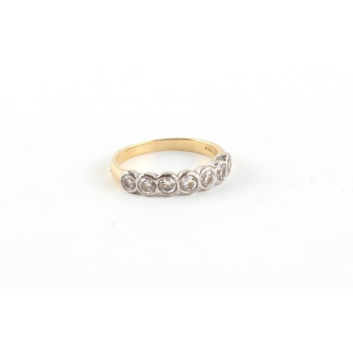 156 - Property of a lady - an 18ct yellow gold diamond seven stone ring, the round brilliant cut diamonds ... 