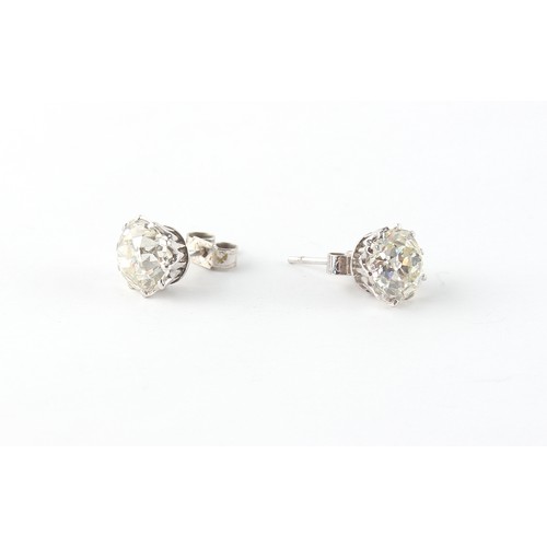 280 - Property of a lady - a pair of large diamond stud earrings, the two Old European cut diamonds each a... 