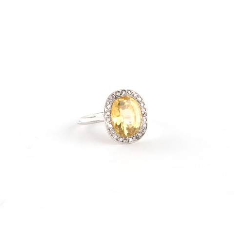 278 - An 18ct white gold natural yellow sapphire & diamond oval ring, the certificated unheated Ceylon nat... 