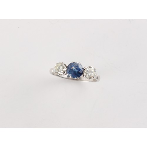 178 - An 18ct white gold sapphire & diamond three stone ring, the centre cushion cut sapphire weighing app... 