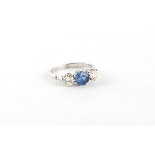 178 - An 18ct white gold sapphire & diamond three stone ring, the centre cushion cut sapphire weighing app... 