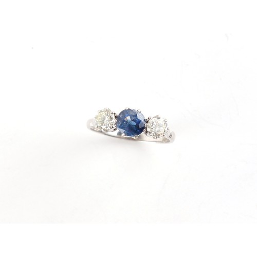 178 - An 18ct white gold sapphire & diamond three stone ring, the centre cushion cut sapphire weighing app... 