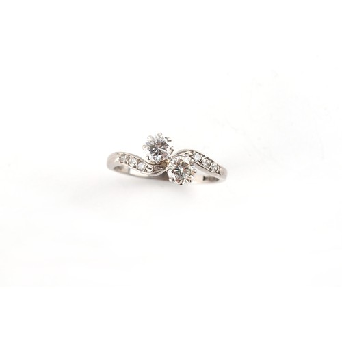 158 - An 18ct white gold & platinum diamond crossover ring, the two round brilliant cut diamonds each weig... 