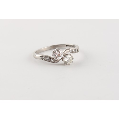 158 - An 18ct white gold & platinum diamond crossover ring, the two round brilliant cut diamonds each weig... 