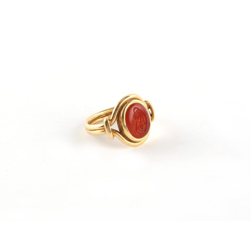 137 - A 19th century unmarked 18ct yellow gold (tested) carnelian agate signet ring, with banded shoulders... 