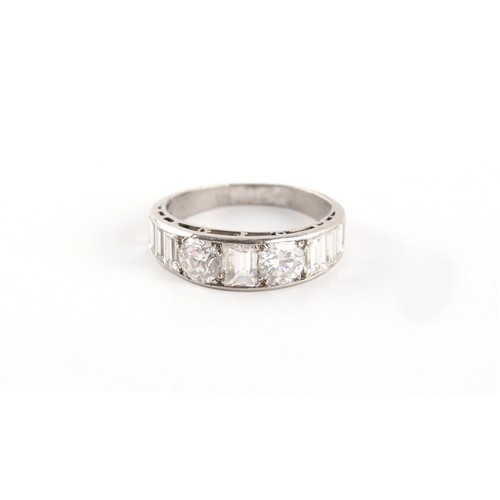 180 - Property of a gentleman - an unmarked platinum (tested) diamond band ring, set with two round brilli... 