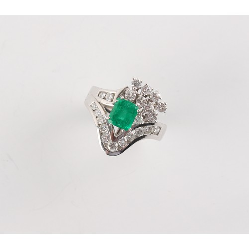 179 - Property of a gentleman - an 18ct white gold emerald & diamond ring, the octagonal cut emerald weigh... 