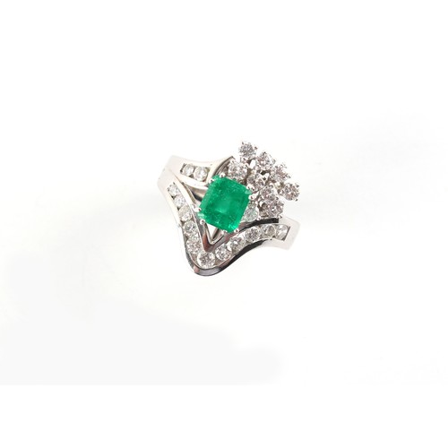 179 - Property of a gentleman - an 18ct white gold emerald & diamond ring, the octagonal cut emerald weigh... 