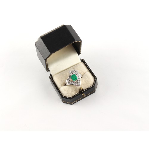 179 - Property of a gentleman - an 18ct white gold emerald & diamond ring, the octagonal cut emerald weigh... 