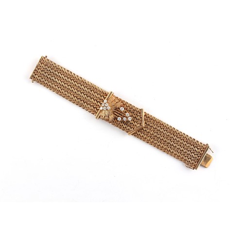 140 - A 9ct gold jarretiere or bracelet, set with eleven round brilliant cut diamonds weighing a total of ... 