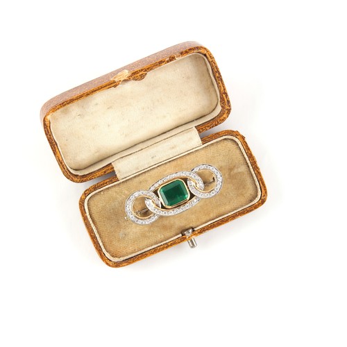 92 - An unmarked white & yellow gold emerald & diamond interlinking loops brooch, the emerald weighing ap... 