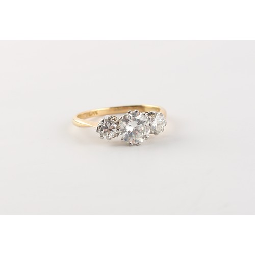 97 - An 18ct yellow gold diamond three stone ring, the centre round brilliant cut diamond weighing approx... 