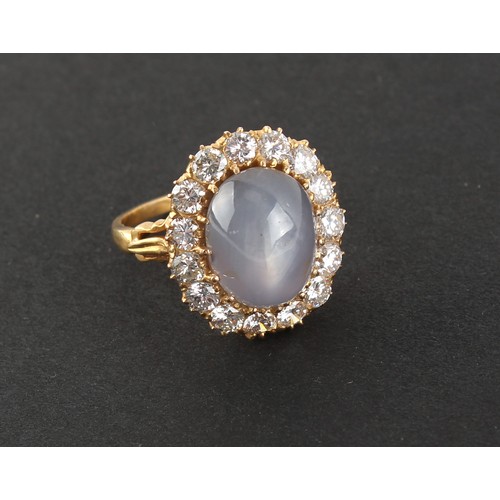 183 - A yellow gold star sapphire & diamond oval cluster ring, the certificated untreated natural star sap... 