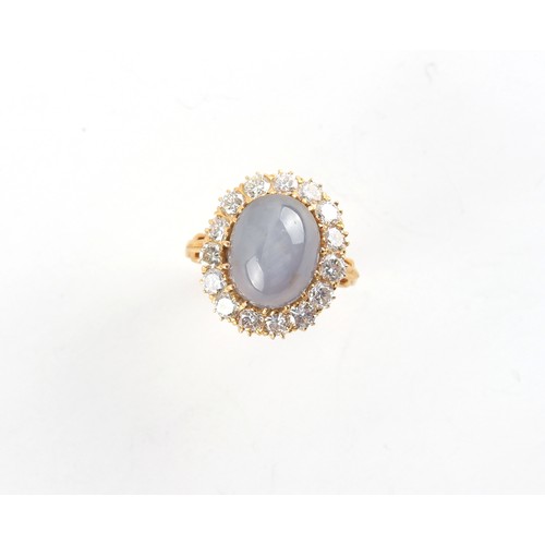 183 - A yellow gold star sapphire & diamond oval cluster ring, the certificated untreated natural star sap... 