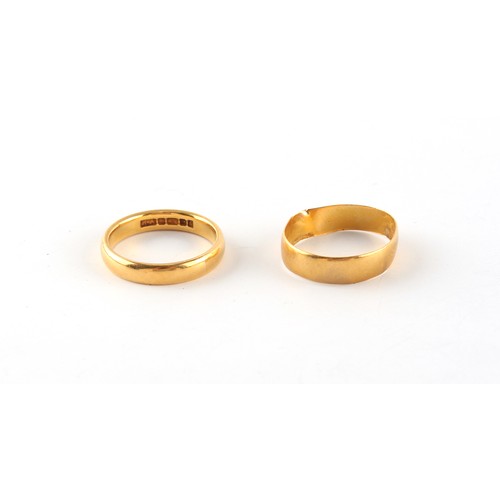 65 - Property of a gentleman - a plain 22ct gold wedding band, size K, approximately 4.2 grams; together ... 