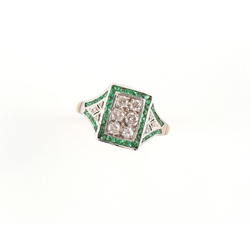 93 - A yellow gold emerald & diamond rectangular panel ring, with six round cut diamonds pave set within ... 