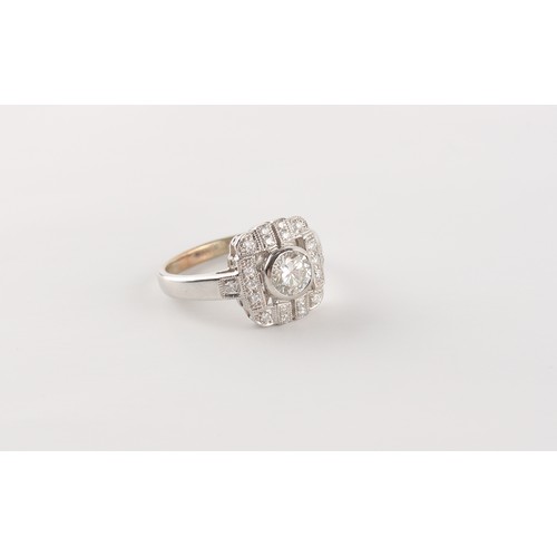 62 - An Art deco style white gold or platinum diamond ring, the round brilliant cut centre stone weighing... 