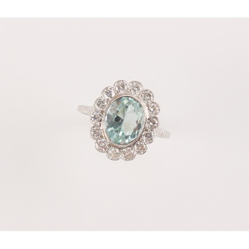 182 - An 18ct white gold aquamarine & diamond oval cluster ring, the oval cut aquamarine weighing approxim... 