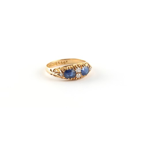 113 - Property of a lady - an early 20th century 18ct gold sapphire & diamond ring, the two oval cushion c... 