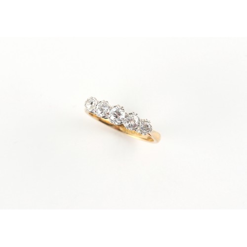 89 - An 18ct yellow gold diamond five stone ring, the five round brilliant cut diamonds weighing an estim... 