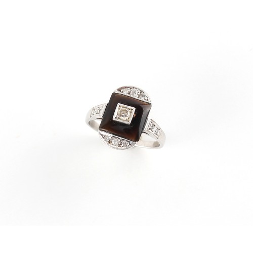 100 - An Art Deco style platinum or white gold black onyx & diamond ring, the head measuring approximately... 