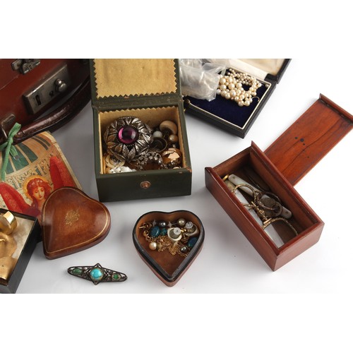 250 - Property of a lady - an attache case containing assorted costume jewellery including a cherry amber ... 