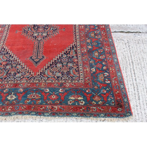 181 - Property of a gentleman - an antique Fereghan Sarouk long rug, with madder ground, 197 by 78ins. (50... 