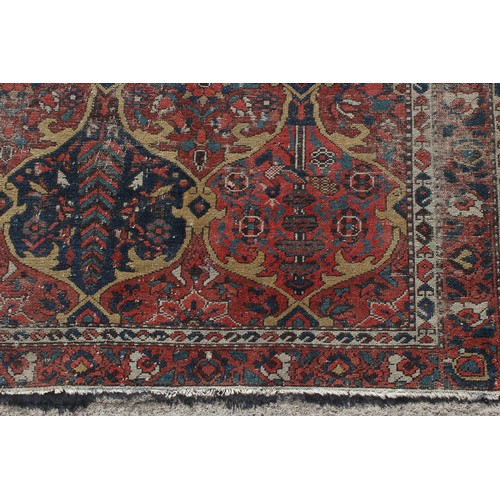 180 - Property of a lady - an early 20th century antique Caucasian rug, worn, 79 by 56ins. (201 by 142cms.... 