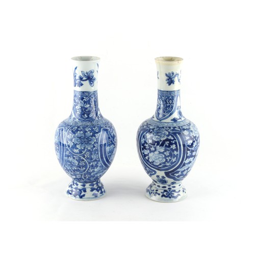 104 - Property of a lady - two similar Chinese blue & white bottle vases, probably Kangxi period (1662-172... 